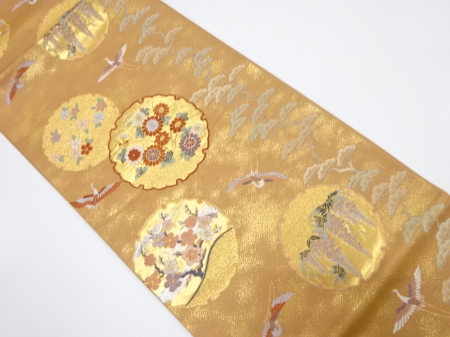 雪輪に小袖文織出し袋帯